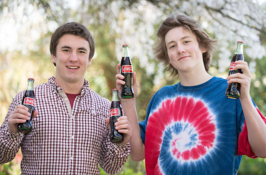 Seattle Family Portrait Photographer, Anita Nowacka photograph of two brothers during photography session letting me know that they need a break for a refreshing beverage of their choice. 