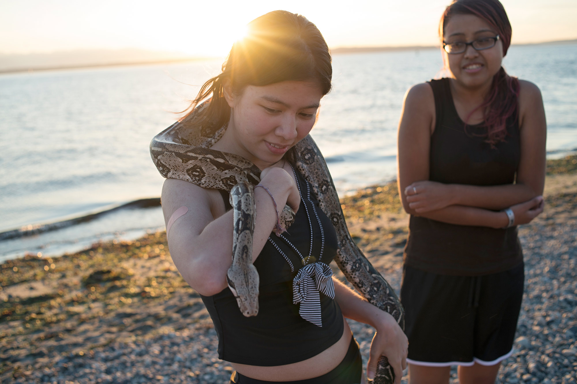 Lifestyle Photographer. Women with a pet snake at Golden Gardens