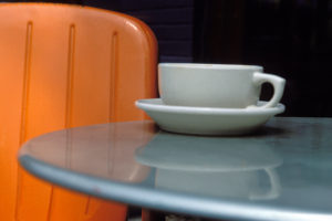 Coffee cup on the table in a cafe