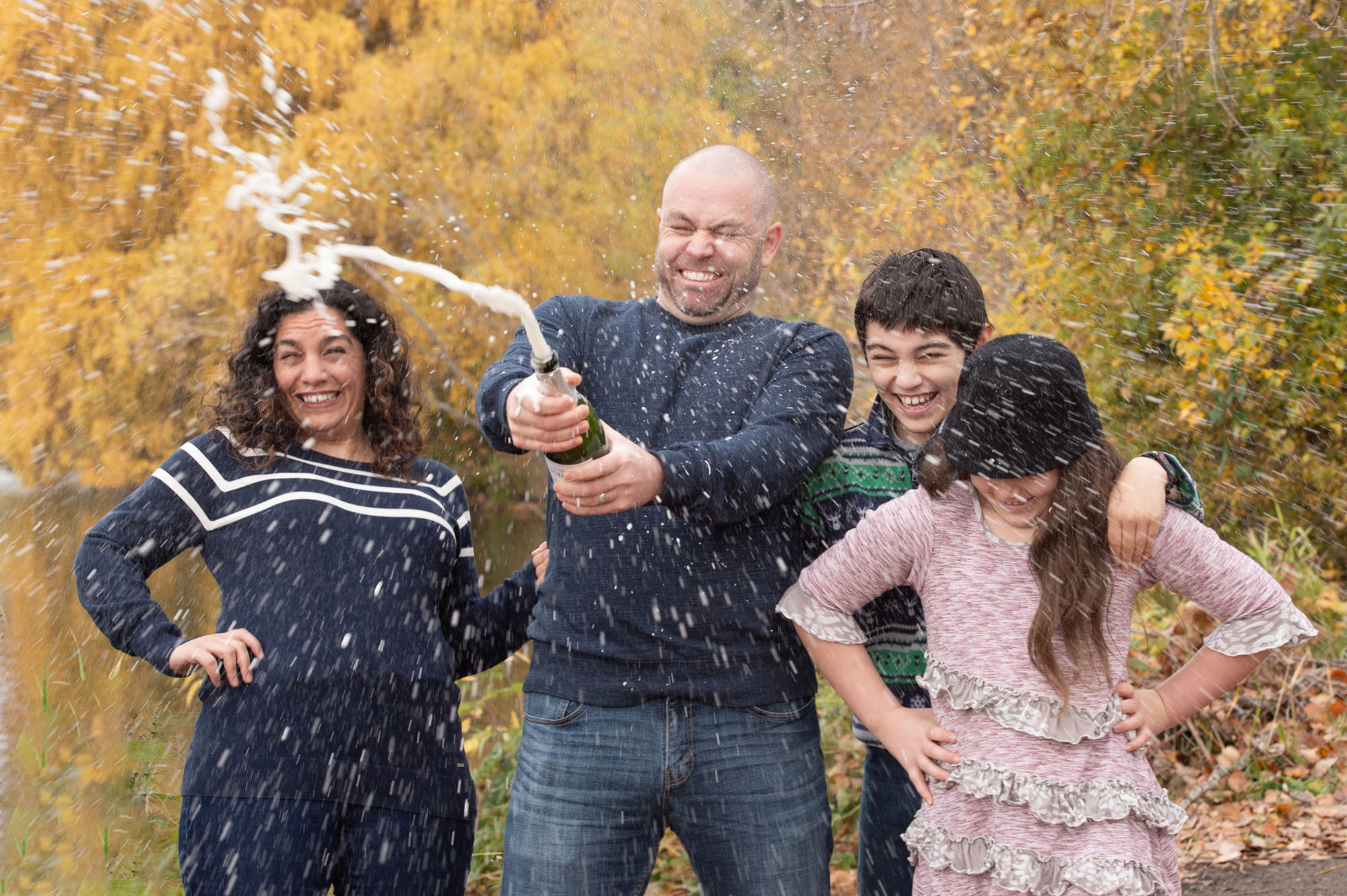 Photographer, Anita Nowacka. Seattle family in celebratory mood during their family portriat session.